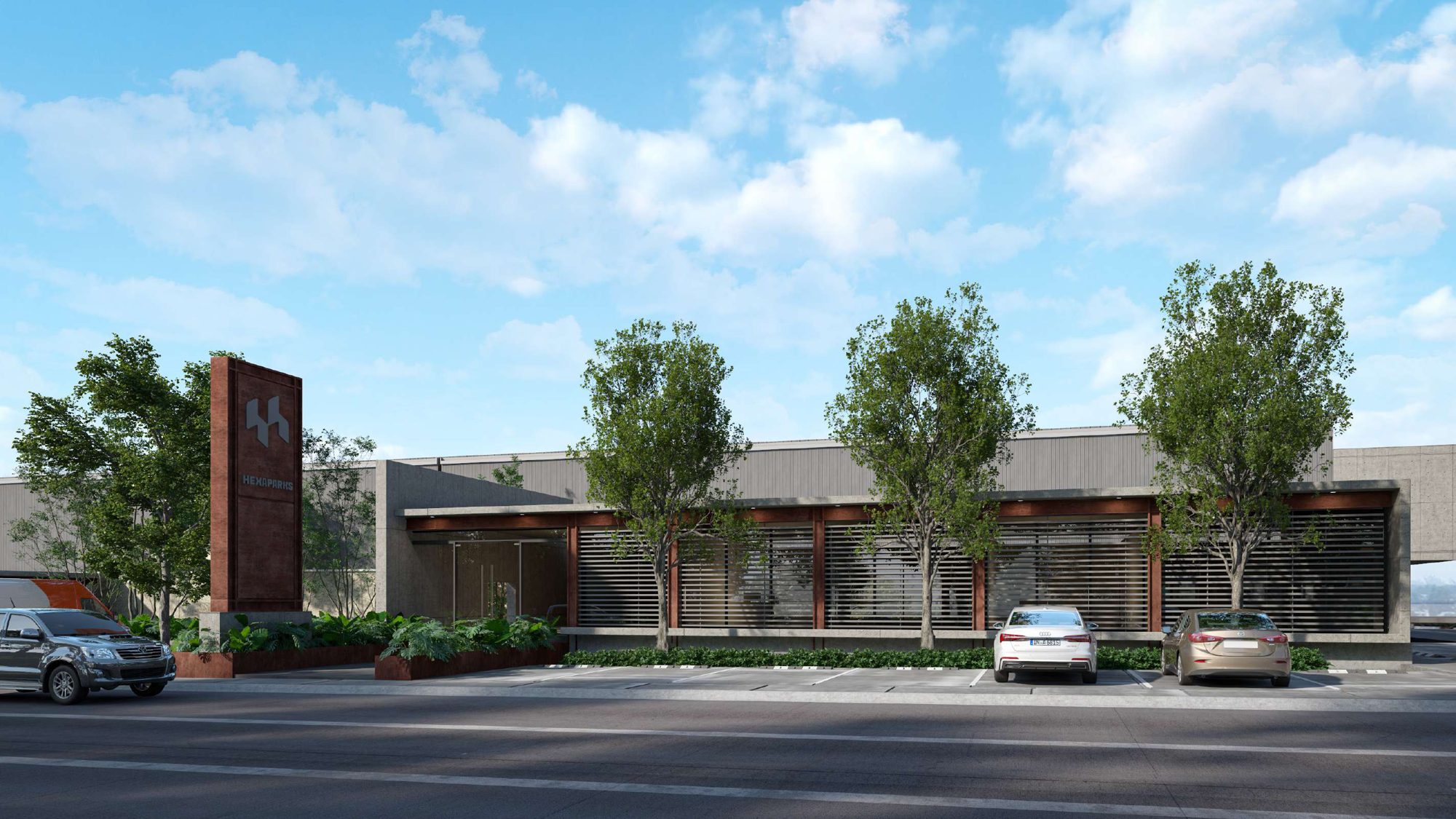 Business center facade with corten tower and landscaping