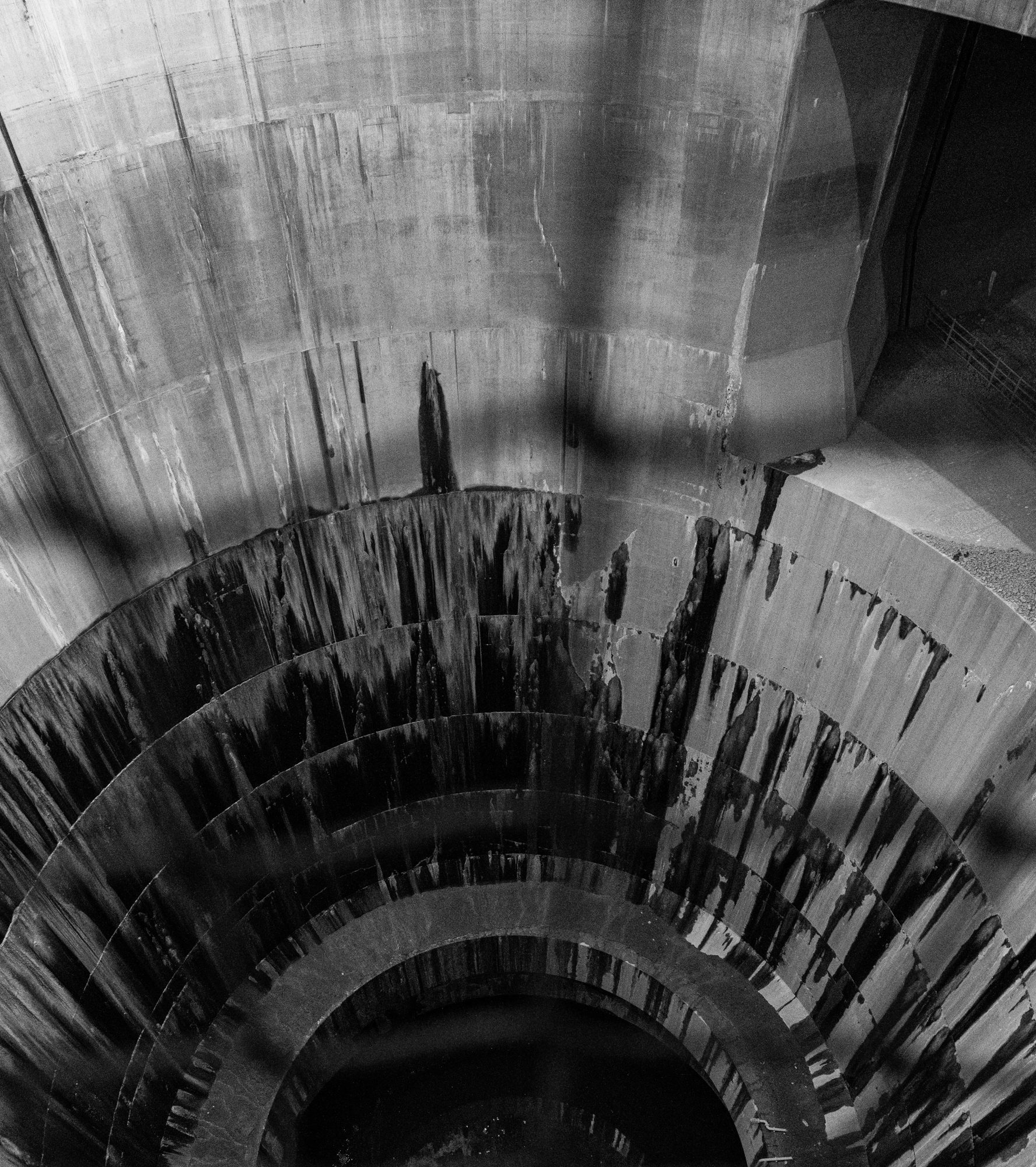 Concrete storm drain shaft in black and white